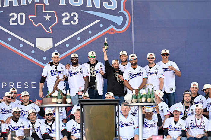 The Texas Rangers pose for a photo during the celebration outside of the ballpark after the World Series championship parade at Globe Life Field.